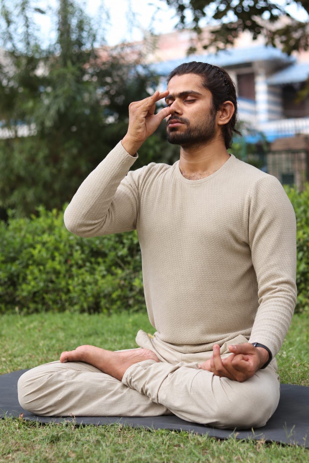Yogacharya Manish practising pranayama outdoors